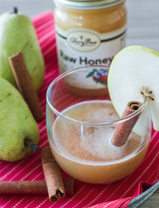 spiced pear with honey in background