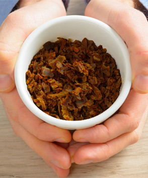 Holding a bowl of propolis