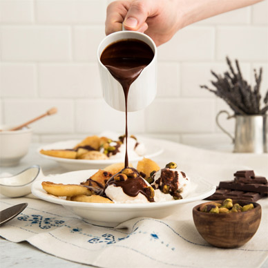Pouring chocolate on a sundae