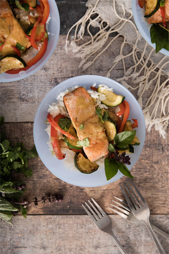 Salmon in Thai-Style Green Coconut Curry on table with forks