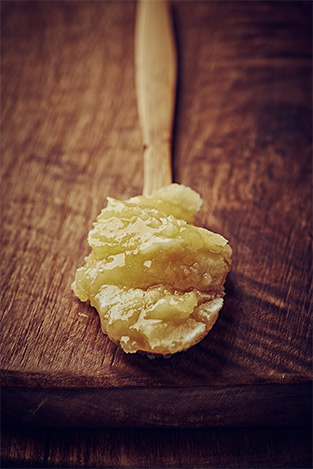Crystallized honey scoop in spoon